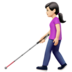 a woman walking with a white cane emoji